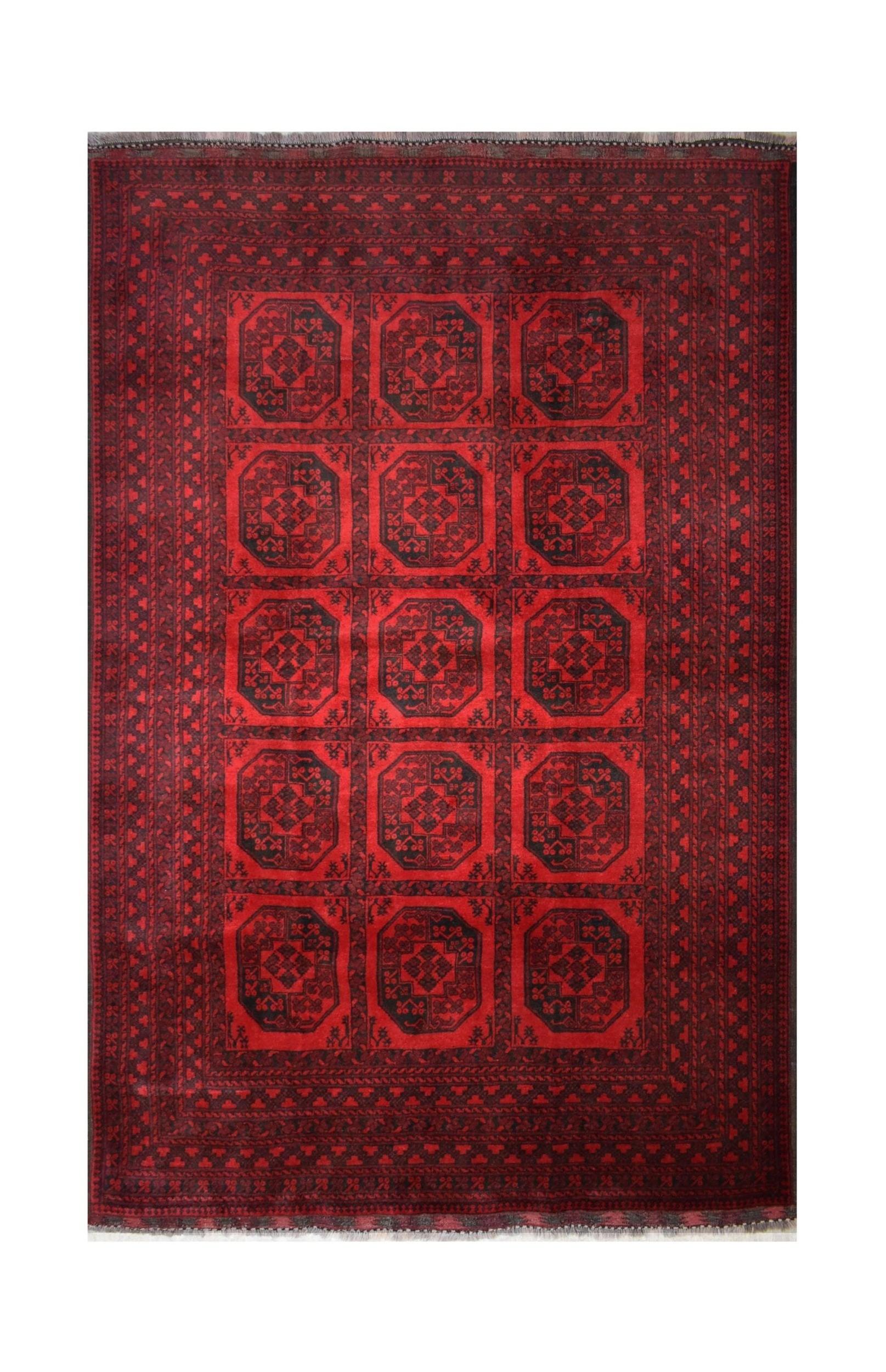 A vintage handmade Afghan Turkmen rug featuring a repeating geometric octagonal pattern in red.