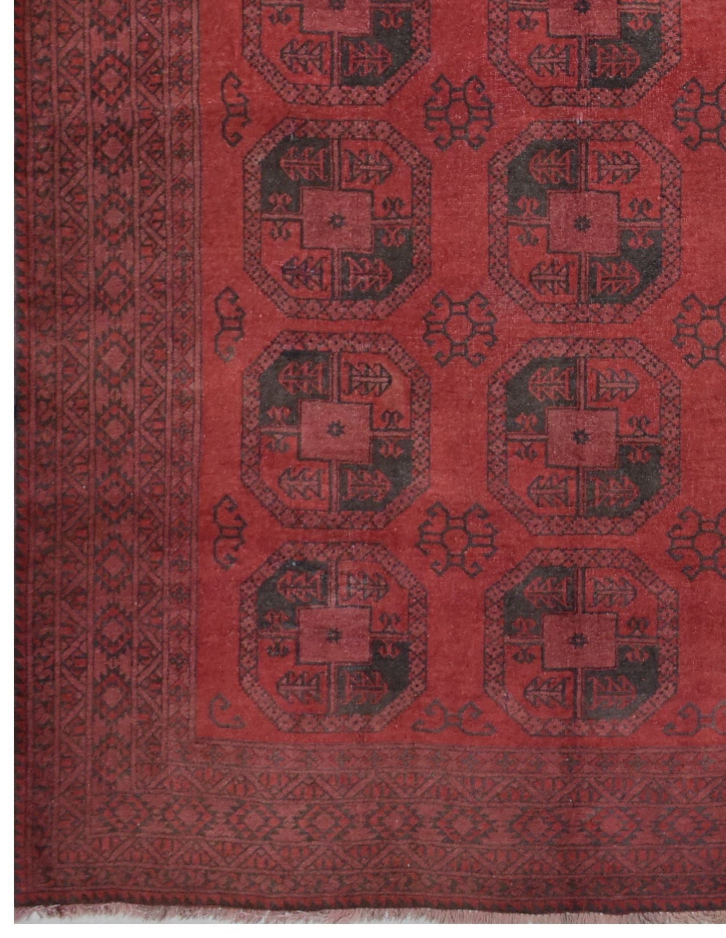 A vintage handmade Afghan Turkmen rug featuring a geometric octagonal pattern in red and black.