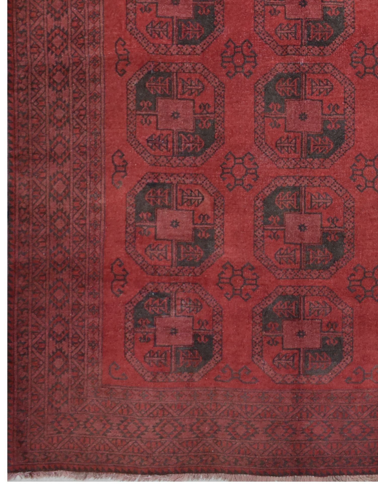 A vintage handmade Afghan Turkmen rug featuring a geometric octagonal pattern in red and black.