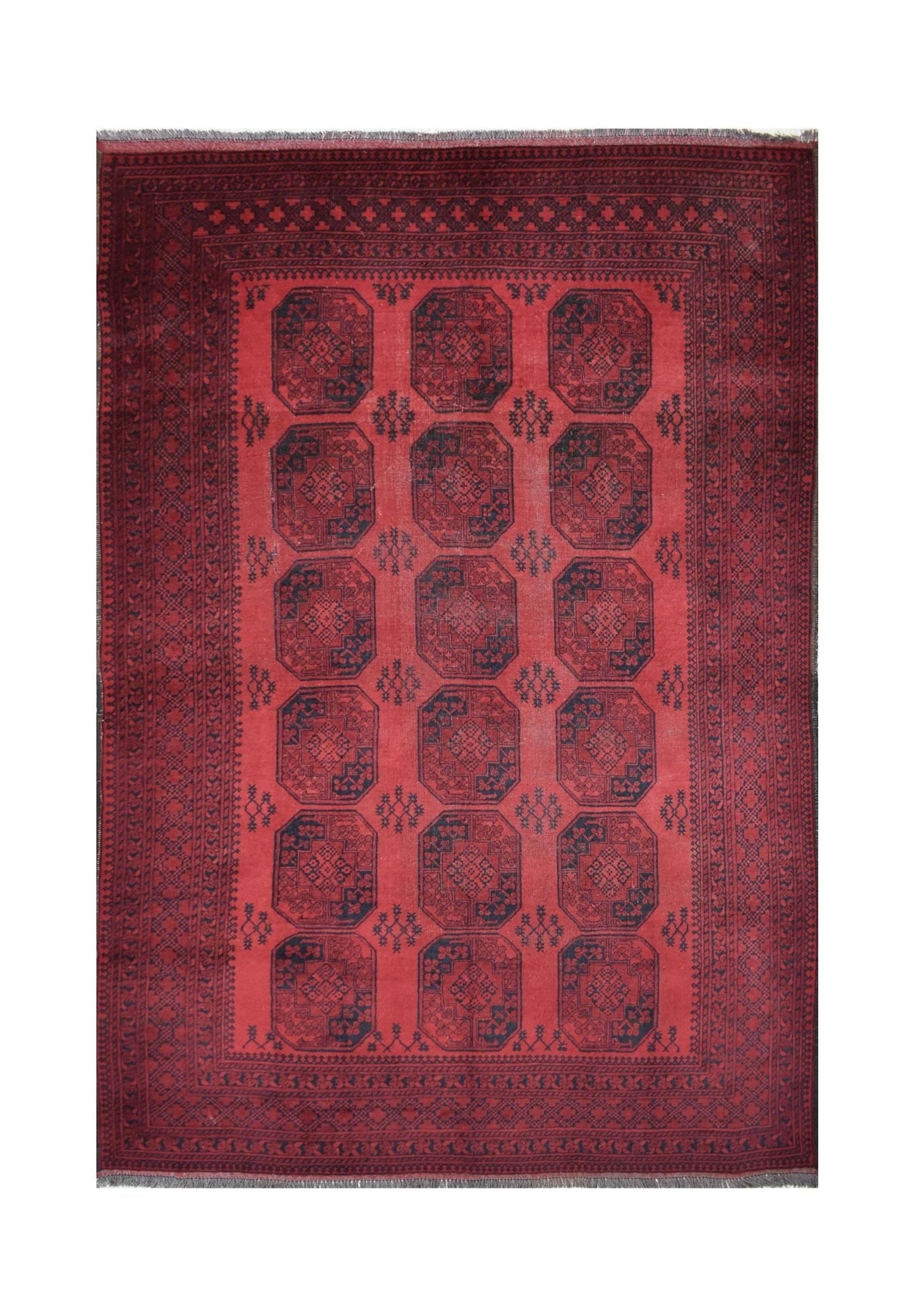 A vintage handmade Afghan Turkmen rug featuring a repeating geometric octagonal pattern in red.