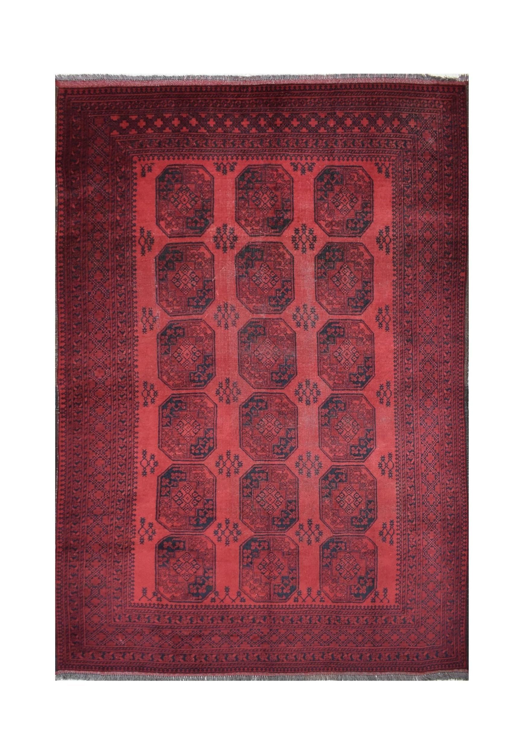 A vintage handmade Afghan Turkmen rug featuring a repeating geometric octagonal pattern in red.