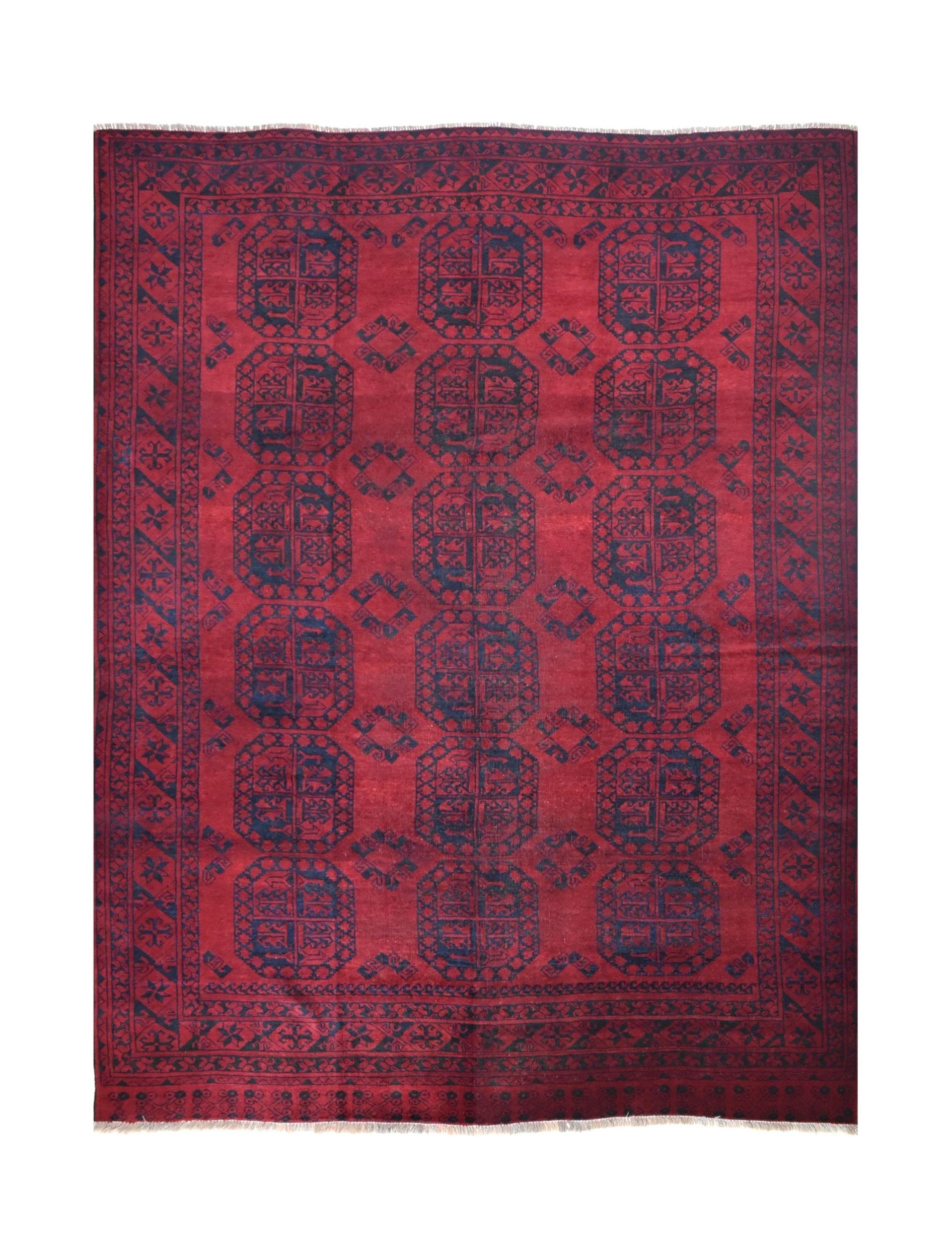 A vintage handmade Afghan Turkmen rug featuring a deep red field with repeating geometric motifs.