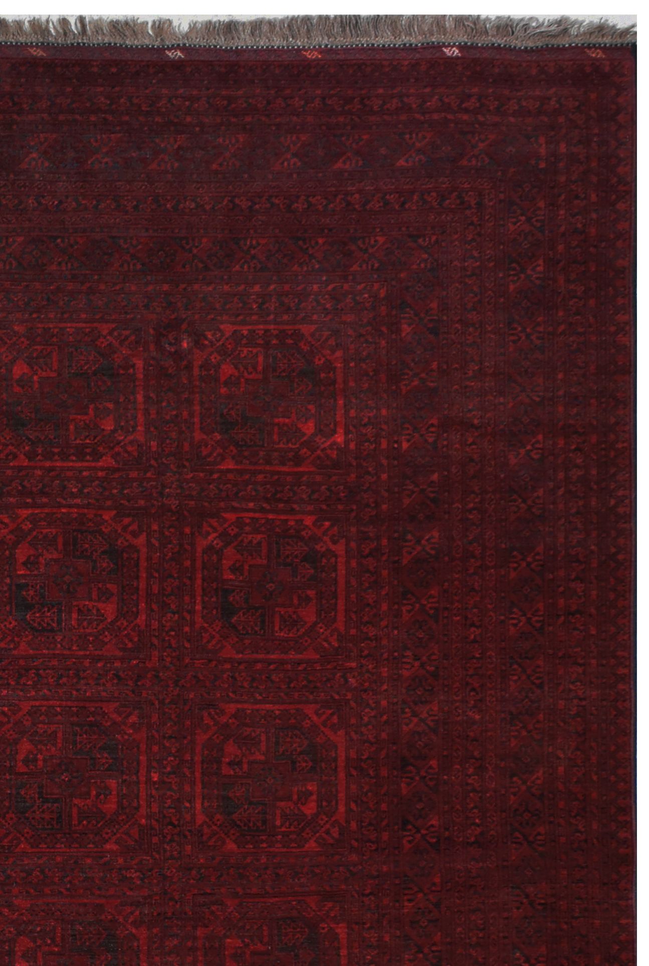 A vintage handmade Afghan Turkmen rug featuring a deep red palette and geometric patterns.