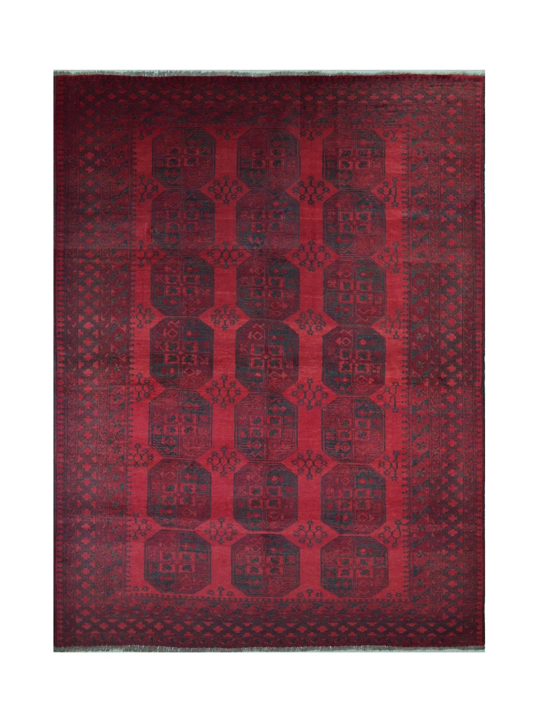 A vintage handmade Afghan Turkmen rug featuring a deep red field with repeating dark octagons.