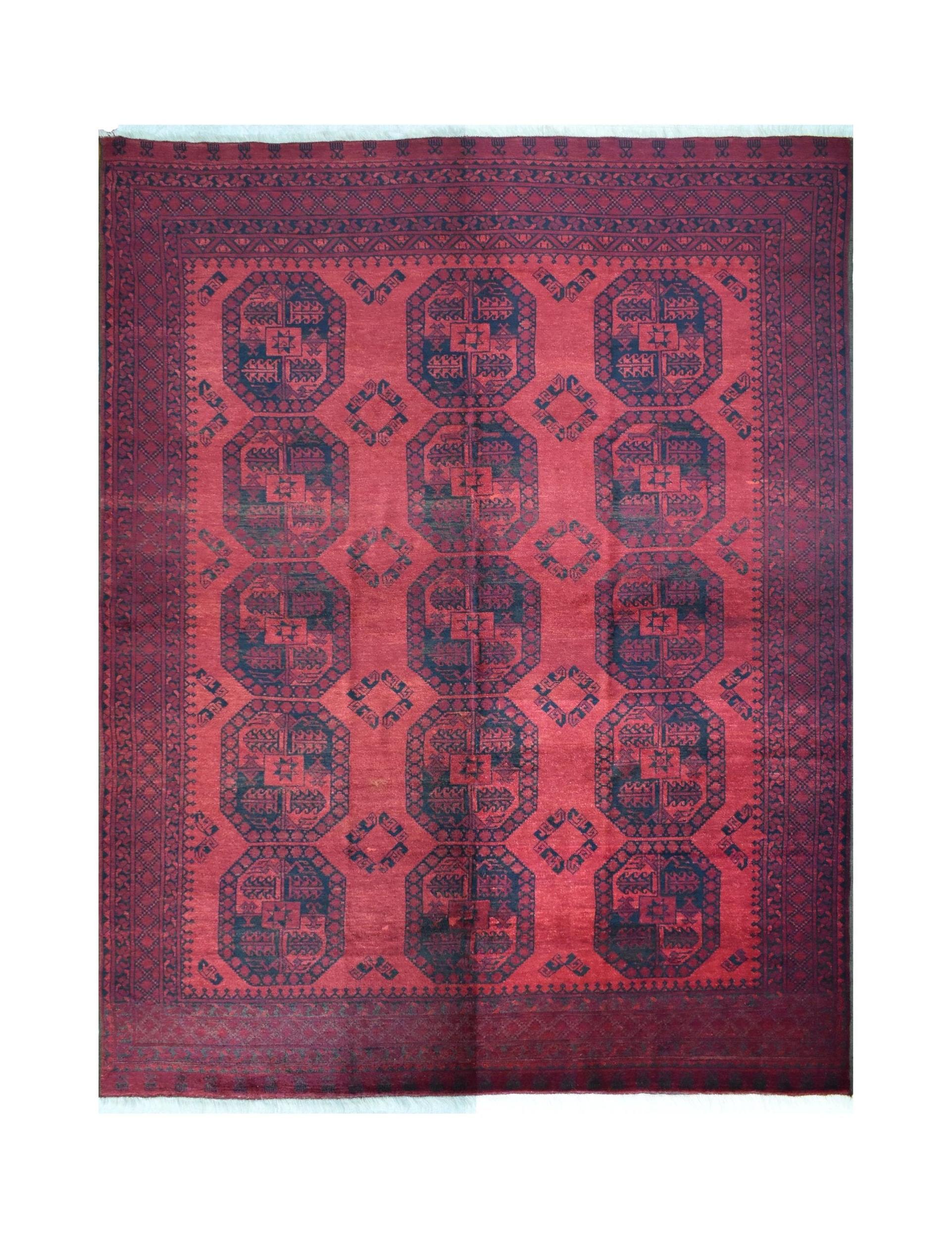 A vintage handmade Afghan Turkmen wool rug featuring a repeating geometric octagonal pattern.