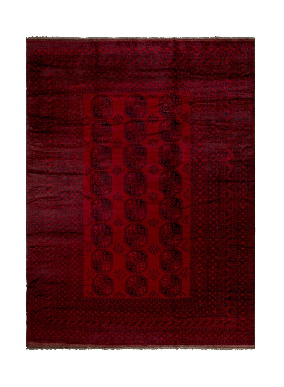 A vintage handmade Afghan Turkmen rug featuring a deep red field with repeating geometric motifs.