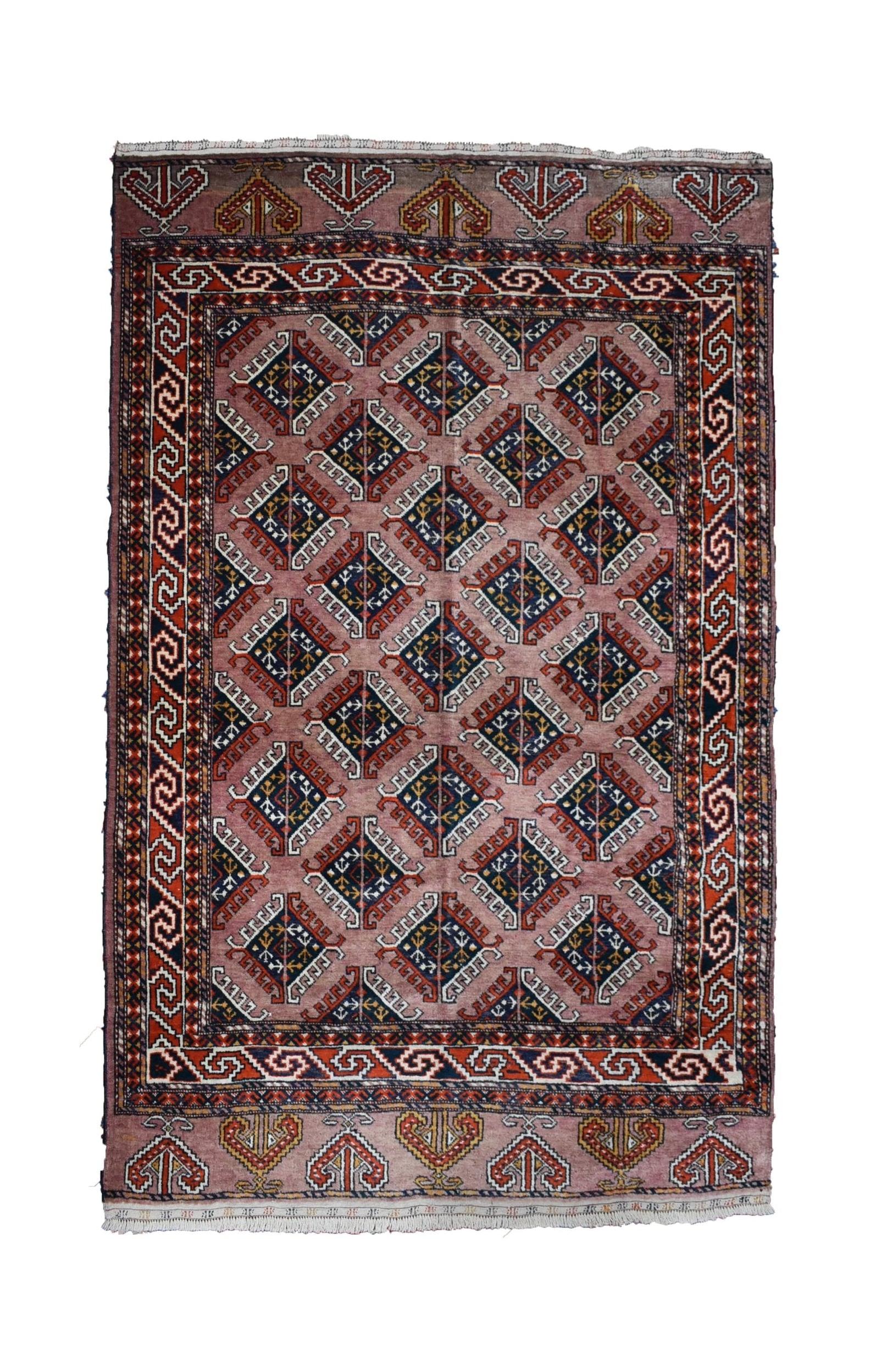 A vintage handmade Uzbek Bokhara rug featuring a repeating diamond pattern in muted pink and blue.