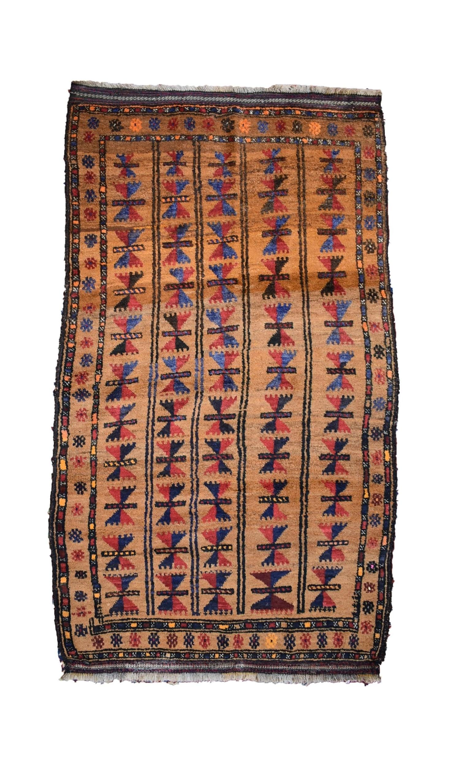 A vintage handmade Afghan Baluch rug featuring vertical stripes of geometric motifs in wool.