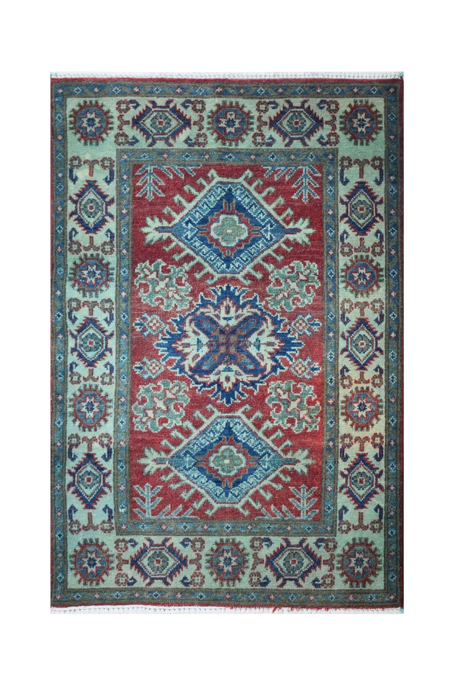Handmade Afghan Kazakh rug featuring a red field with blue geometric medallions and floral motifs.