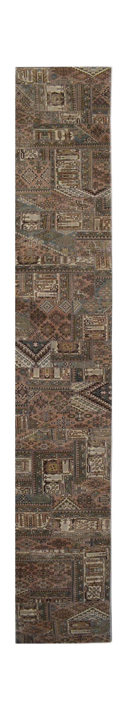 A handmade wool runner rug featuring a vintage-style patchwork design in muted earth tones.