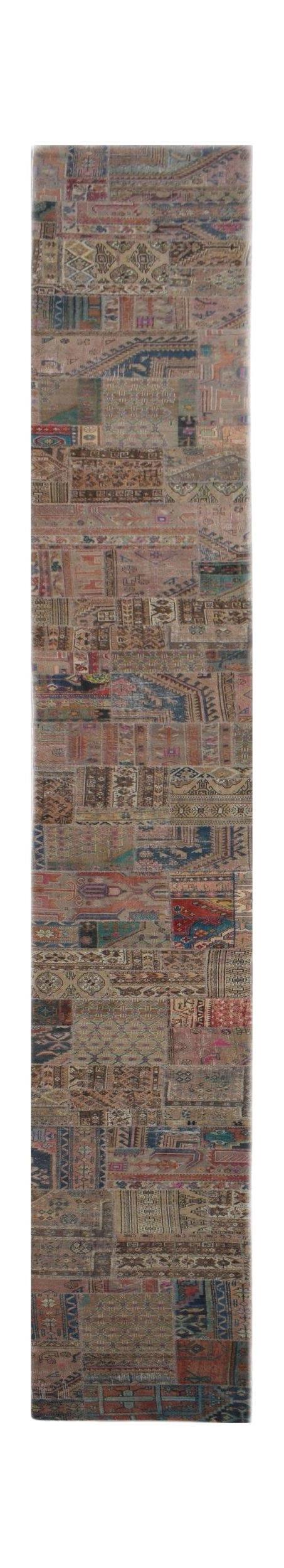A handmade vintage patchwork runner rug featuring a multi-colored wool design on a cotton base.