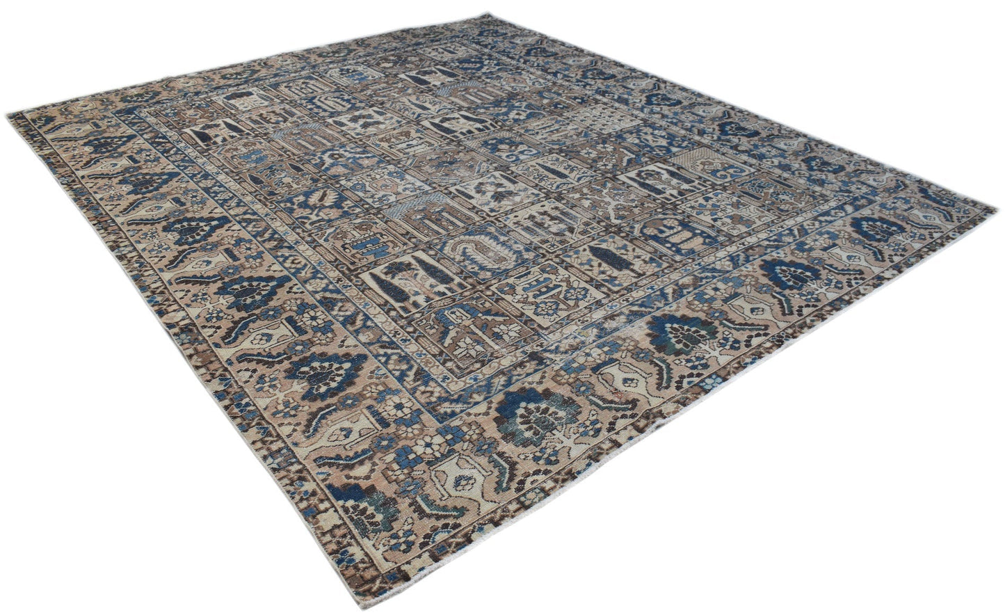A handmade Persian Bakhtiari rug featuring a traditional blue and beige geometric panel design.