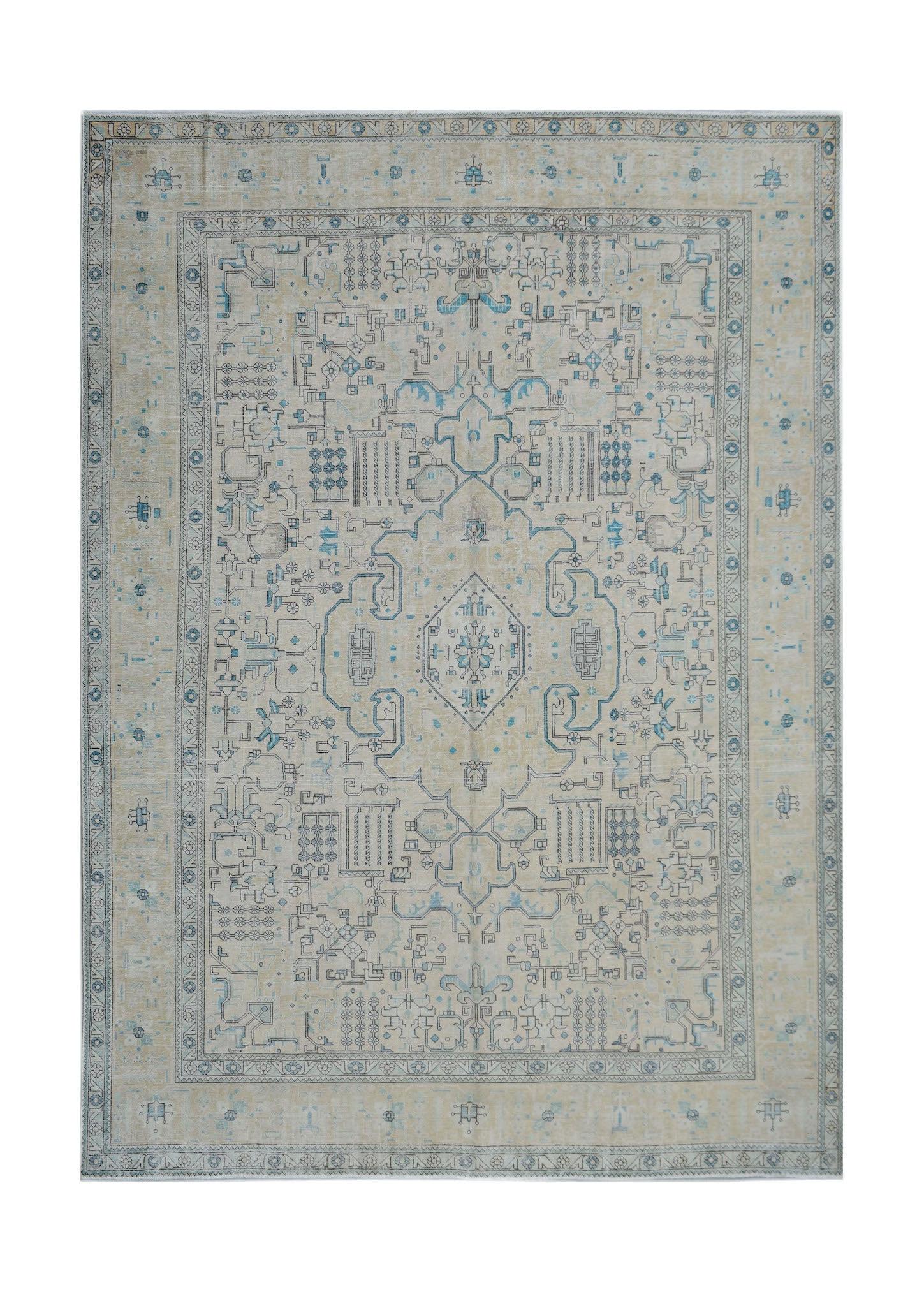 A vintage Persian Kerman rug featuring a central medallion and intricate blue floral patterns.