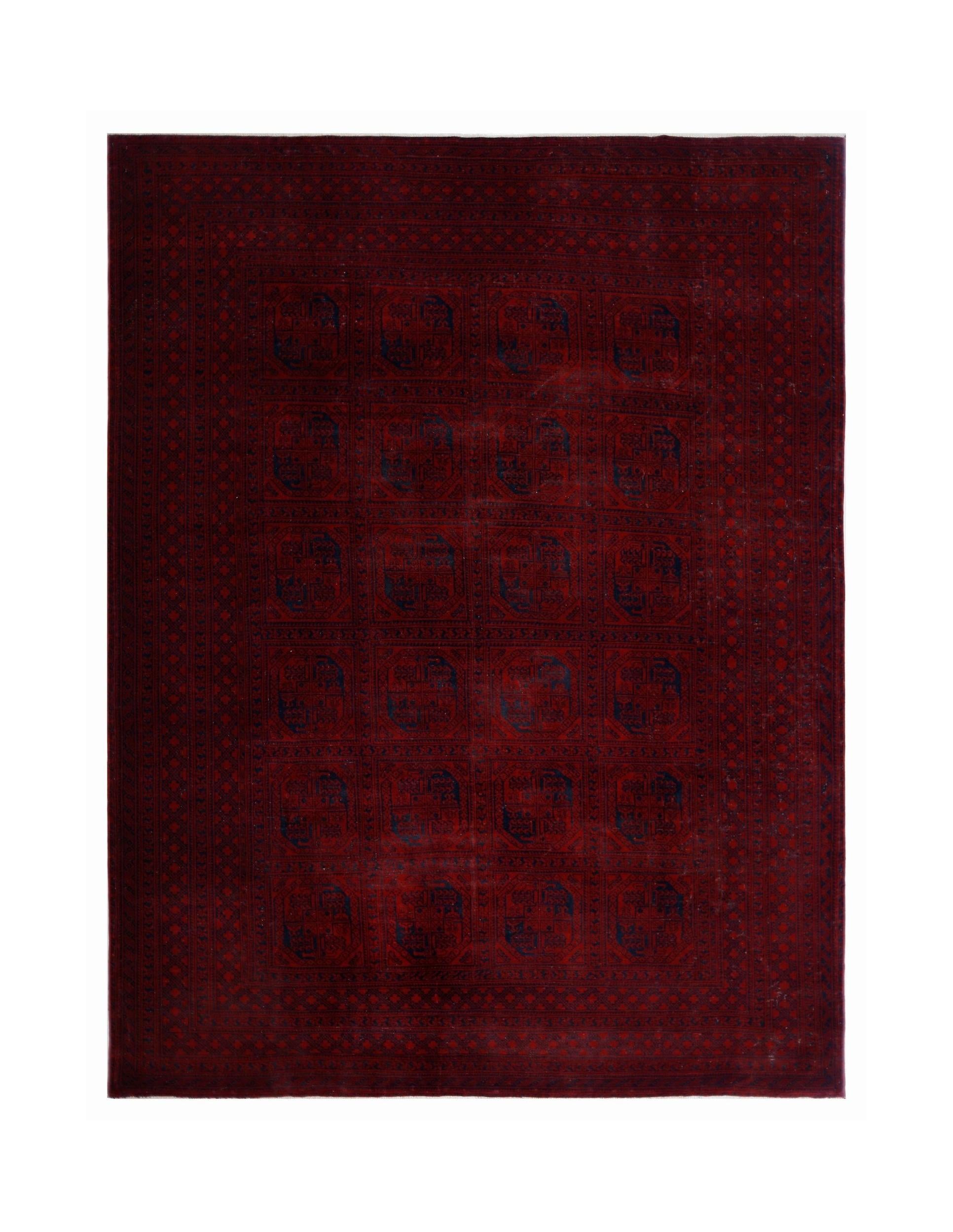 An antique Afghan Turkmen rug featuring a deep red field with repeating blue elephant foot motifs.
