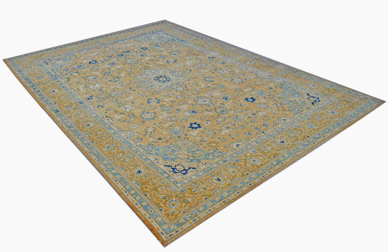 A vintage Persian Kashan rug featuring a central medallion and intricate floral patterns in blue.