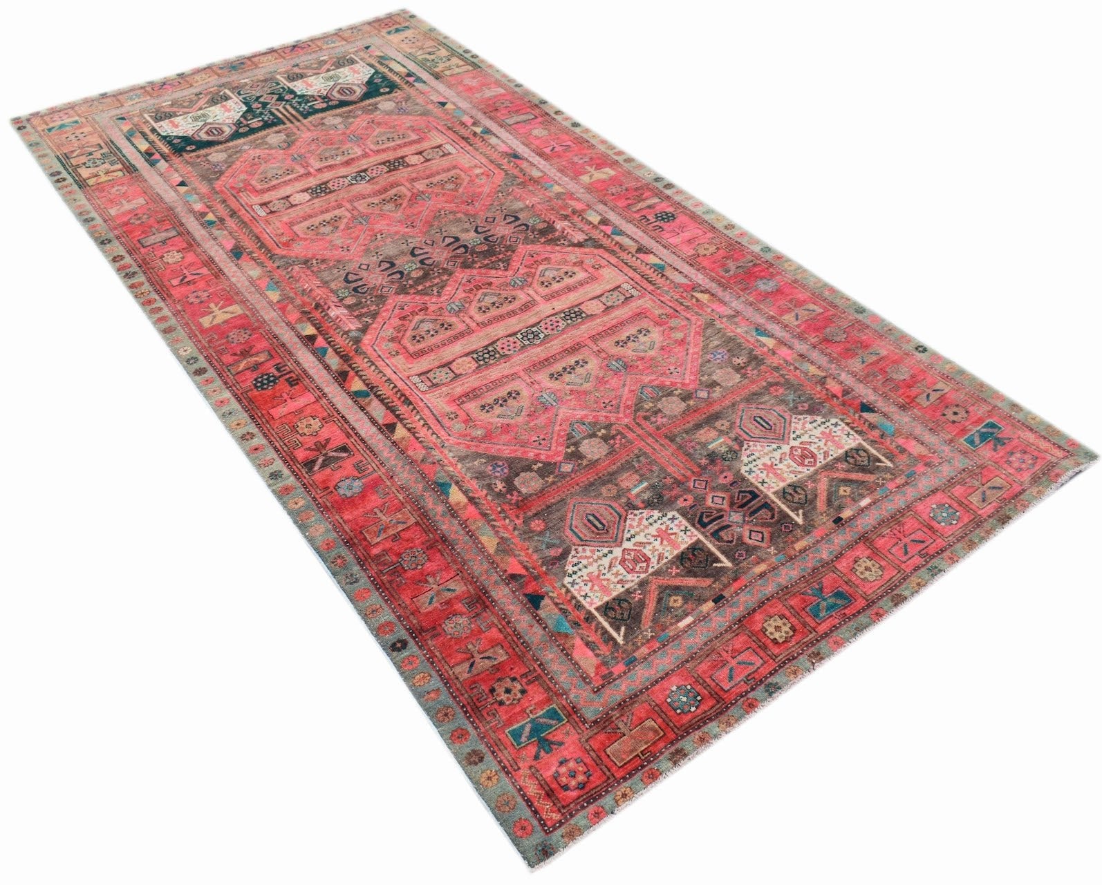 A vintage Persian Koliai rug featuring a pink and brown Throne of Jamshed pattern.