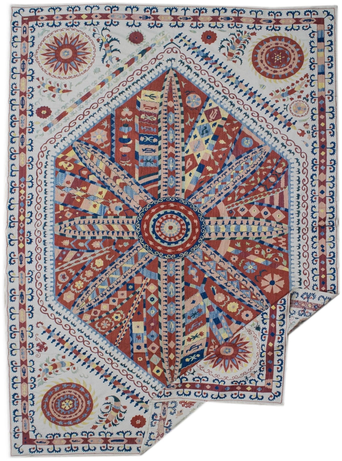 Handmade Uzbek suzani featuring intricate silk embroidery of sun motifs on a cotton base.