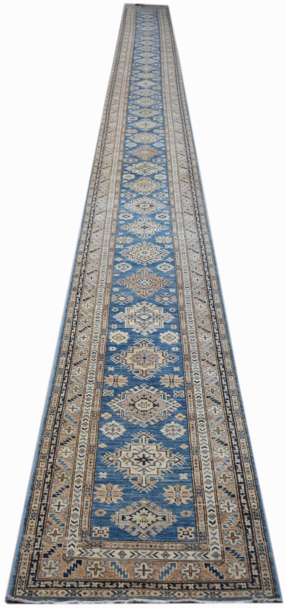 A long, handmade Afghan Super Kazakh runner rug featuring traditional geometric motifs in blue.