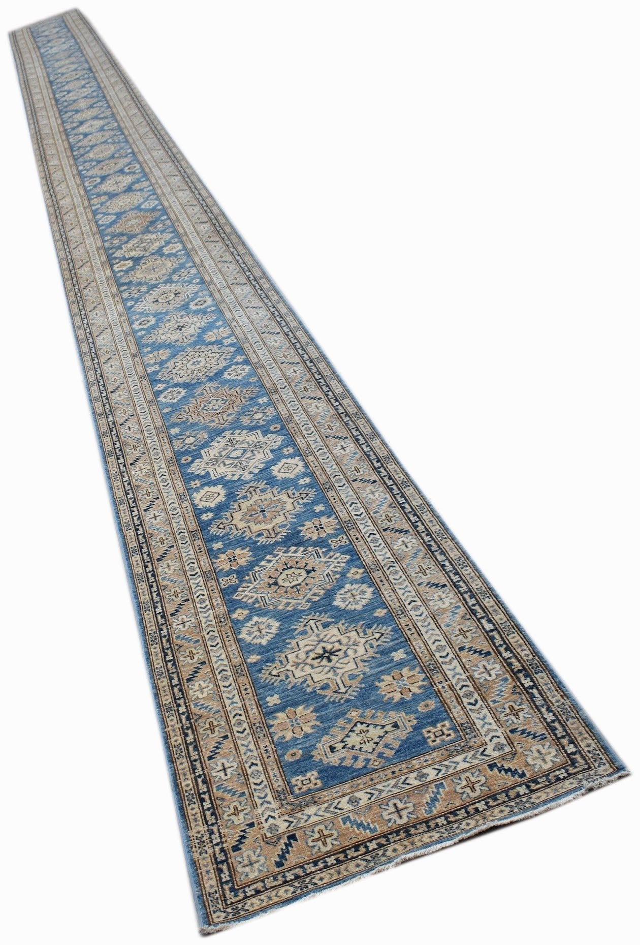 A long, handmade Afghan Super Kazakh runner rug featuring traditional geometric motifs in blue and tan.
