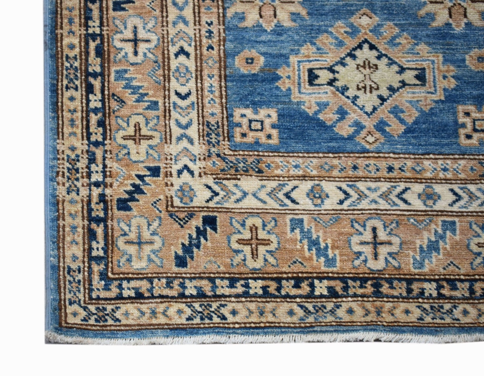 A handmade Afghan Super Kazakh runner rug featuring traditional geometric motifs in blue and tan.