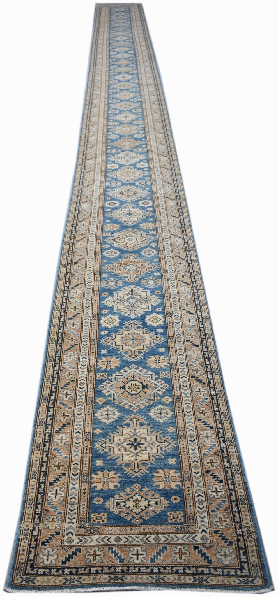 A long, handmade Afghan Super Kazakh runner rug featuring traditional geometric motifs in blue.