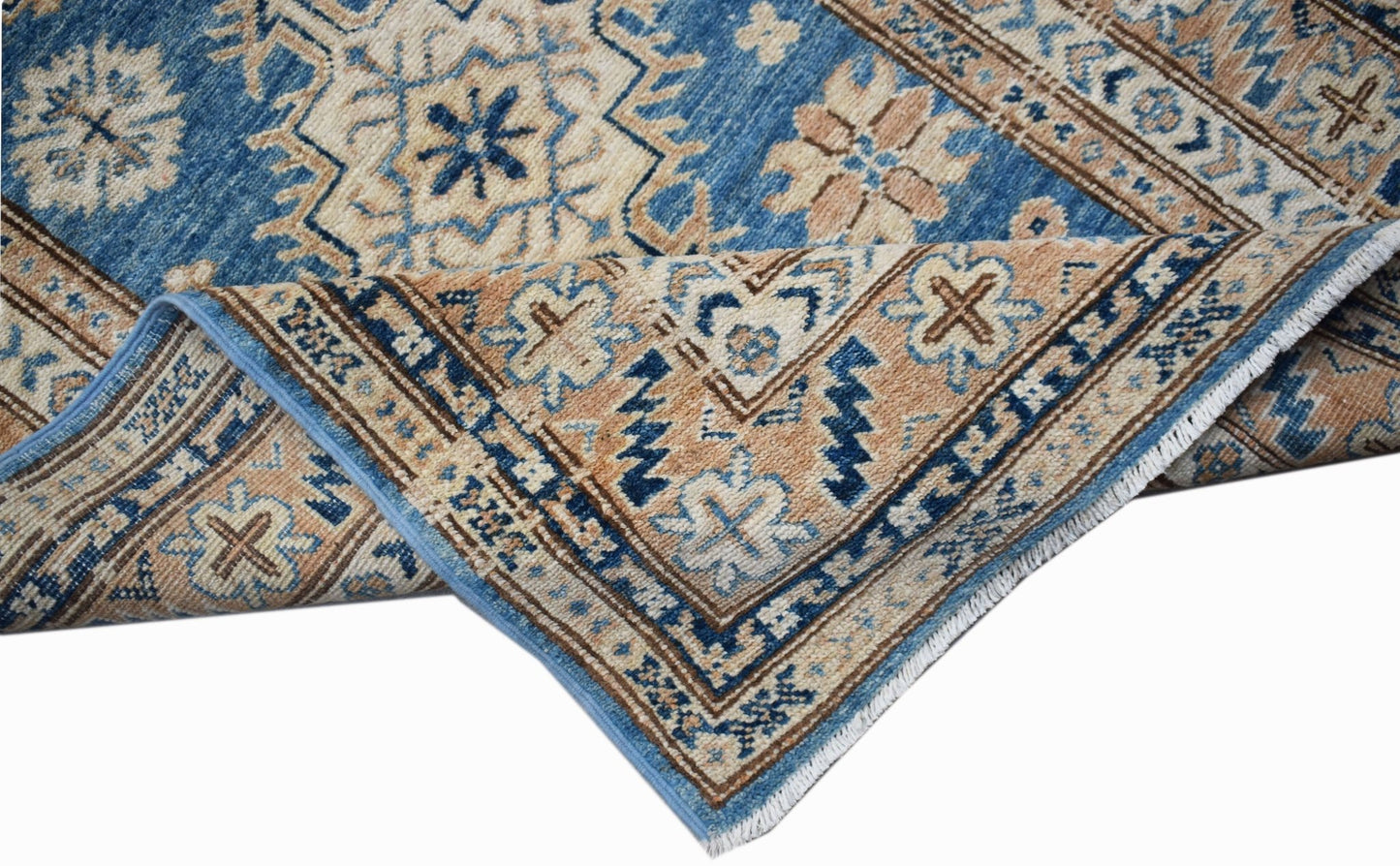 A handmade Afghan Super Kazakh runner featuring traditional geometric motifs in blue and tan.
