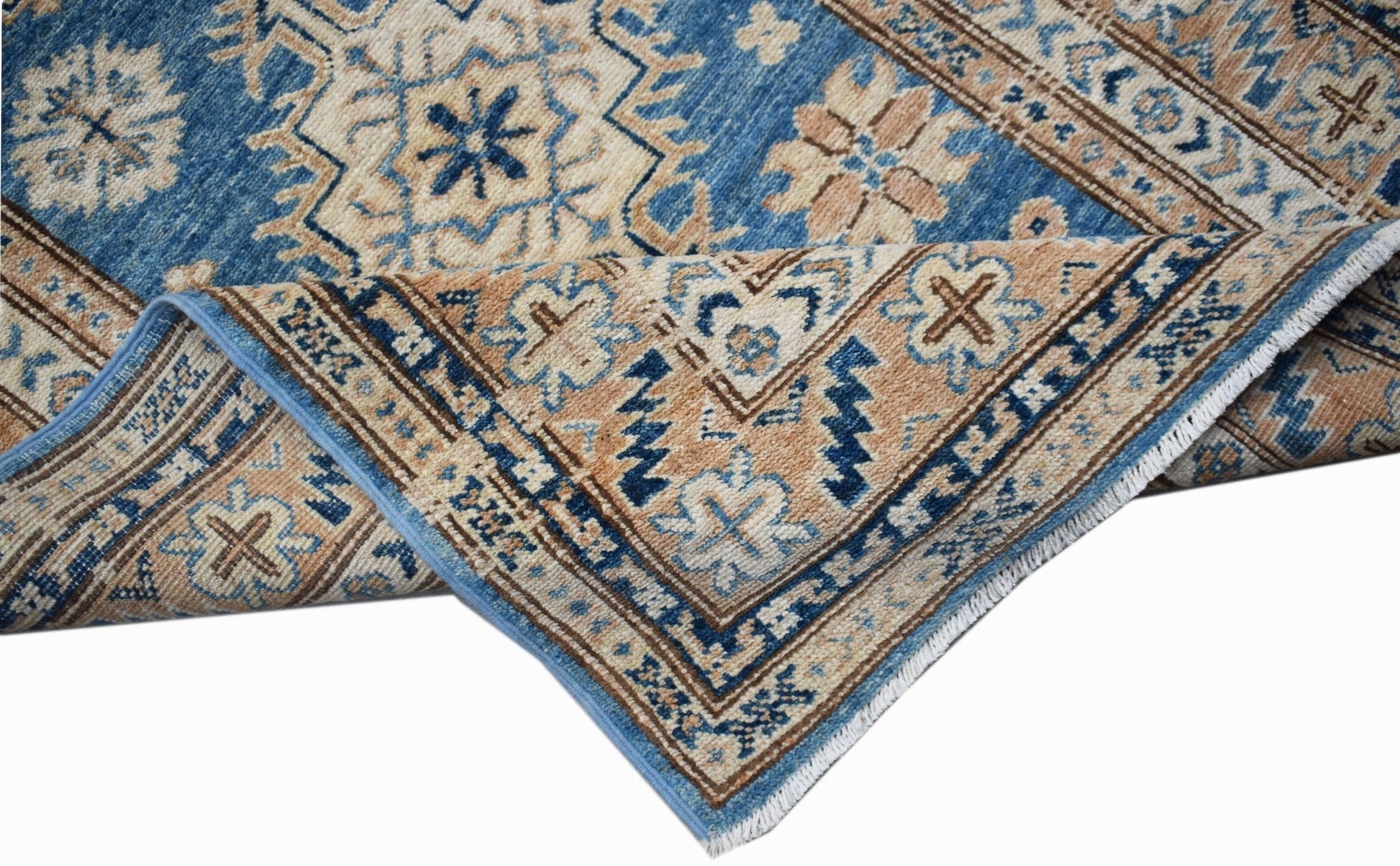 A handmade Afghan Super Kazakh runner featuring traditional geometric motifs in blue and tan.