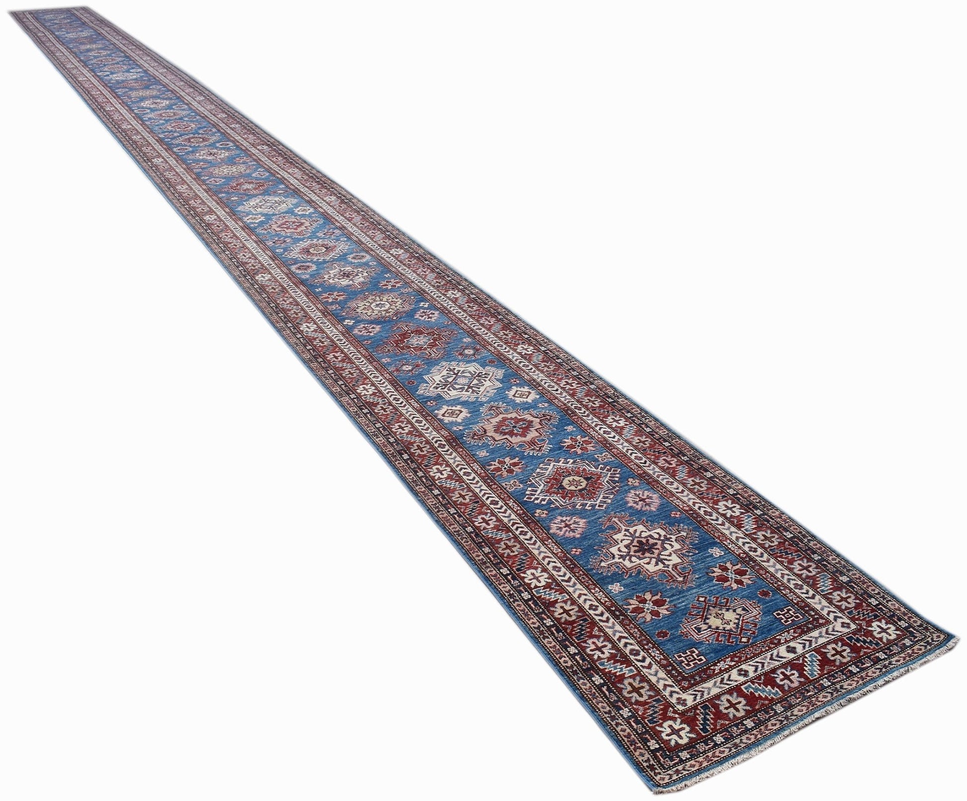 A long, handmade Afghan Super Kazakh runner rug featuring traditional geometric motifs in blue.