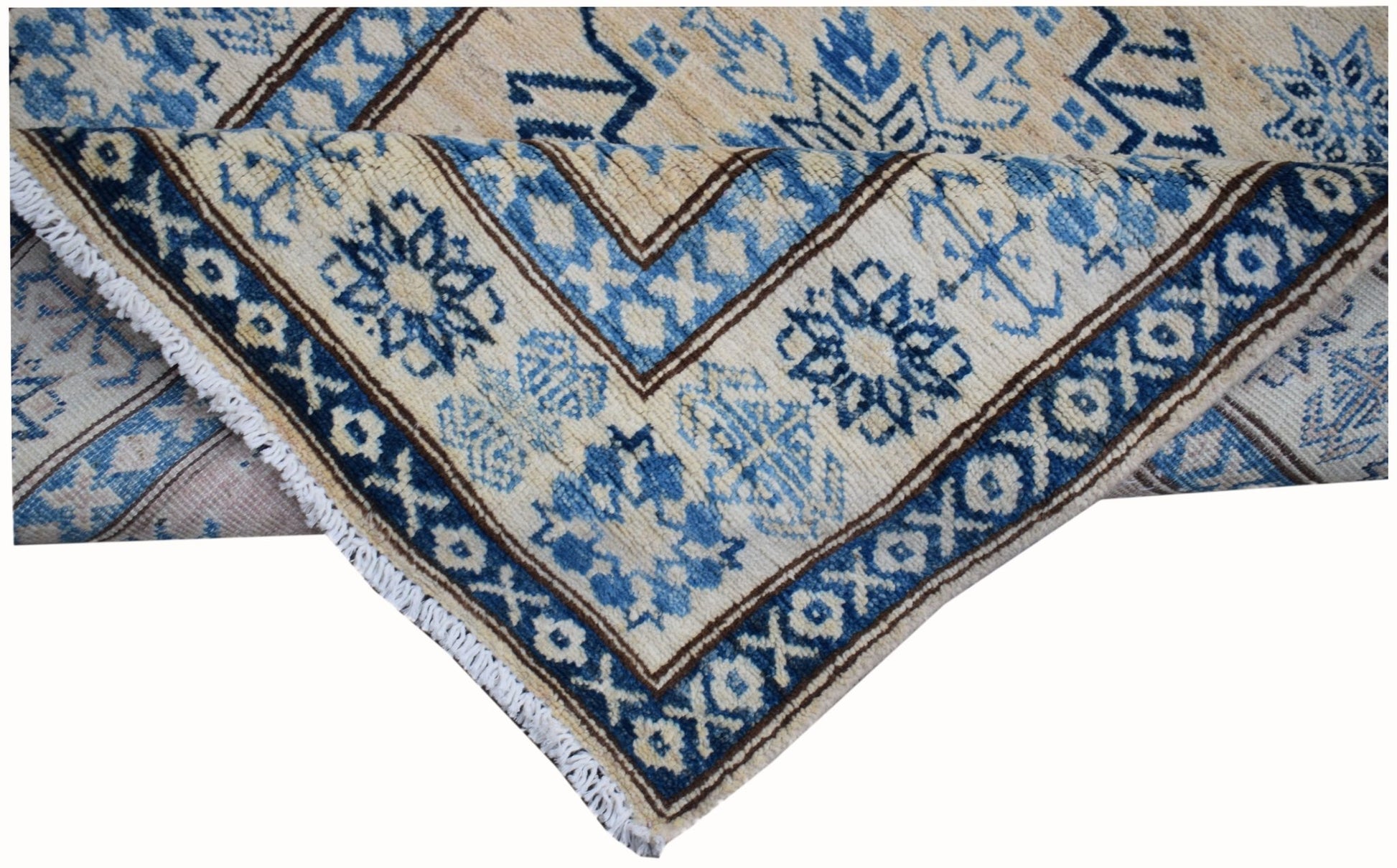 A handmade Afghan Super Kazakh runner featuring a geometric blue and beige pattern.