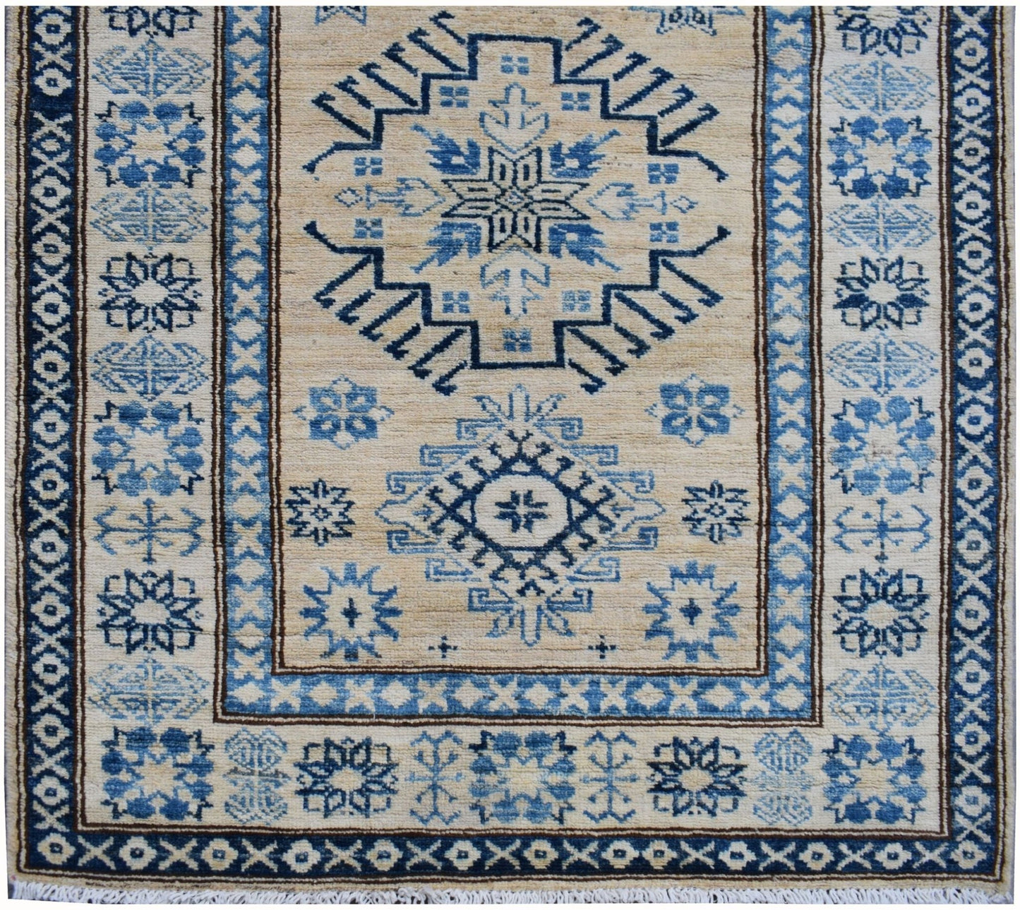 Handmade Afghan Super Kazakh runner rug featuring blue geometric patterns on a beige wool field.