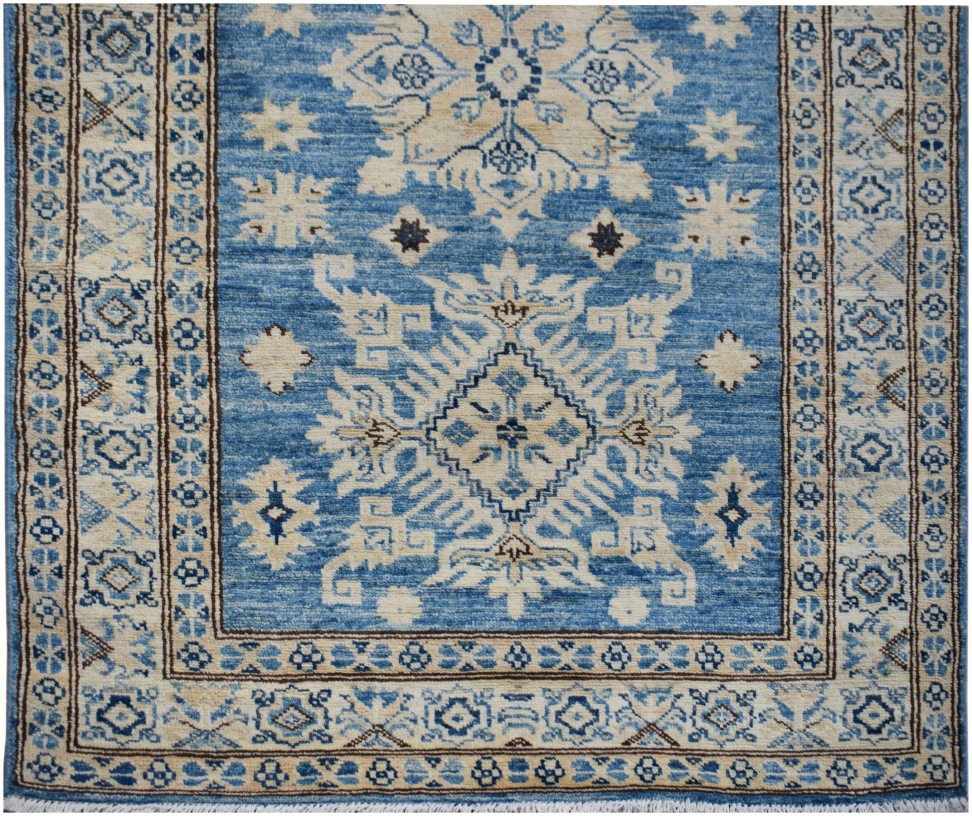 Handmade Afghan Super Kazakh runner rug featuring a blue field with beige geometric motifs.