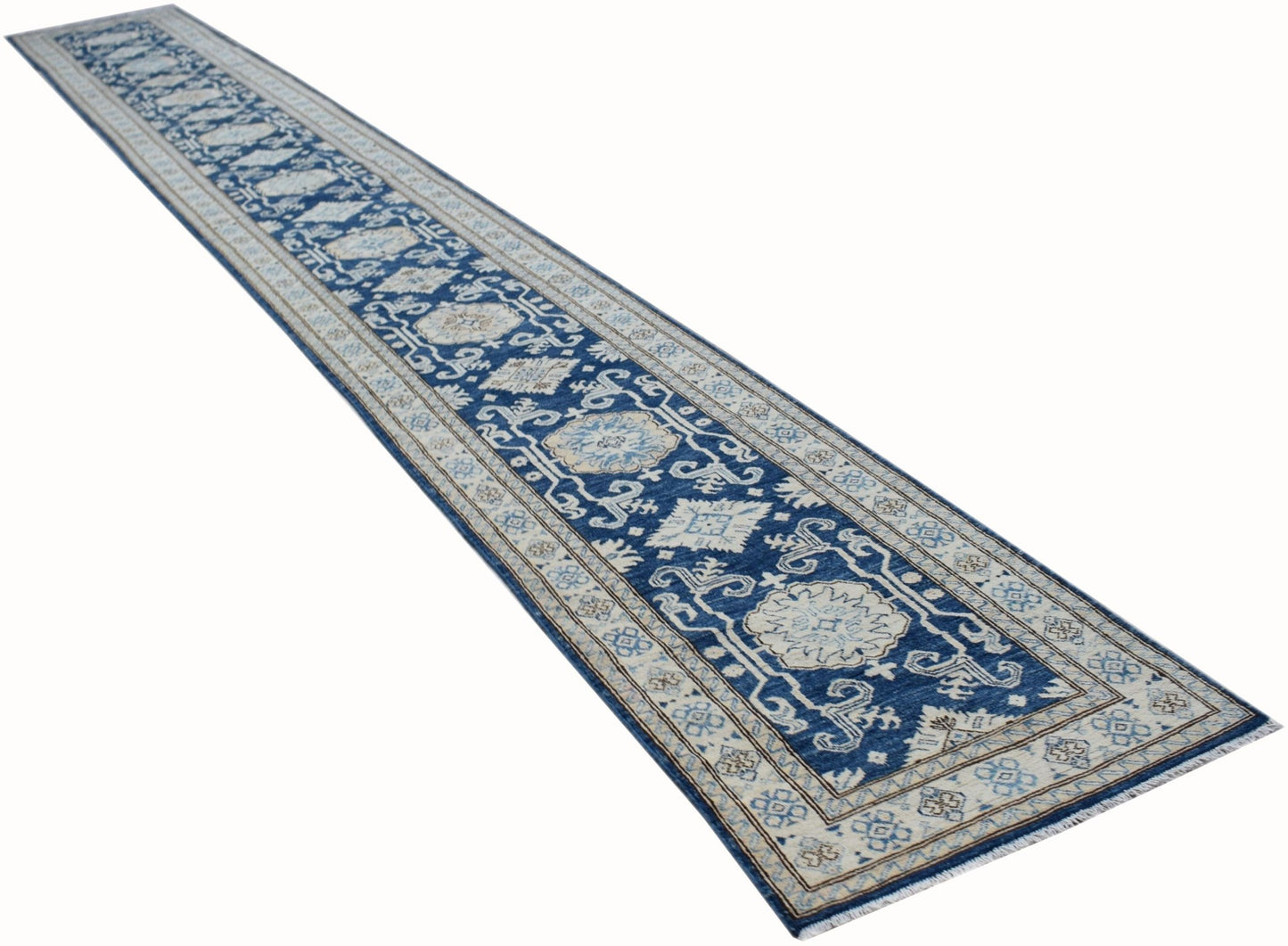 A long, handmade Afghan Super Kazakh runner rug featuring traditional blue and beige patterns.