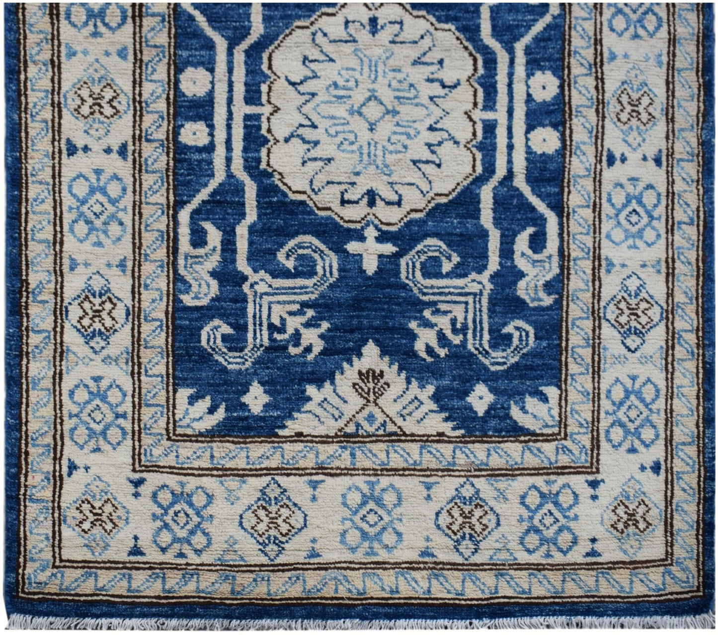 Handmade Afghan Super Kazakh runner rug featuring a blue field with beige geometric patterns.
