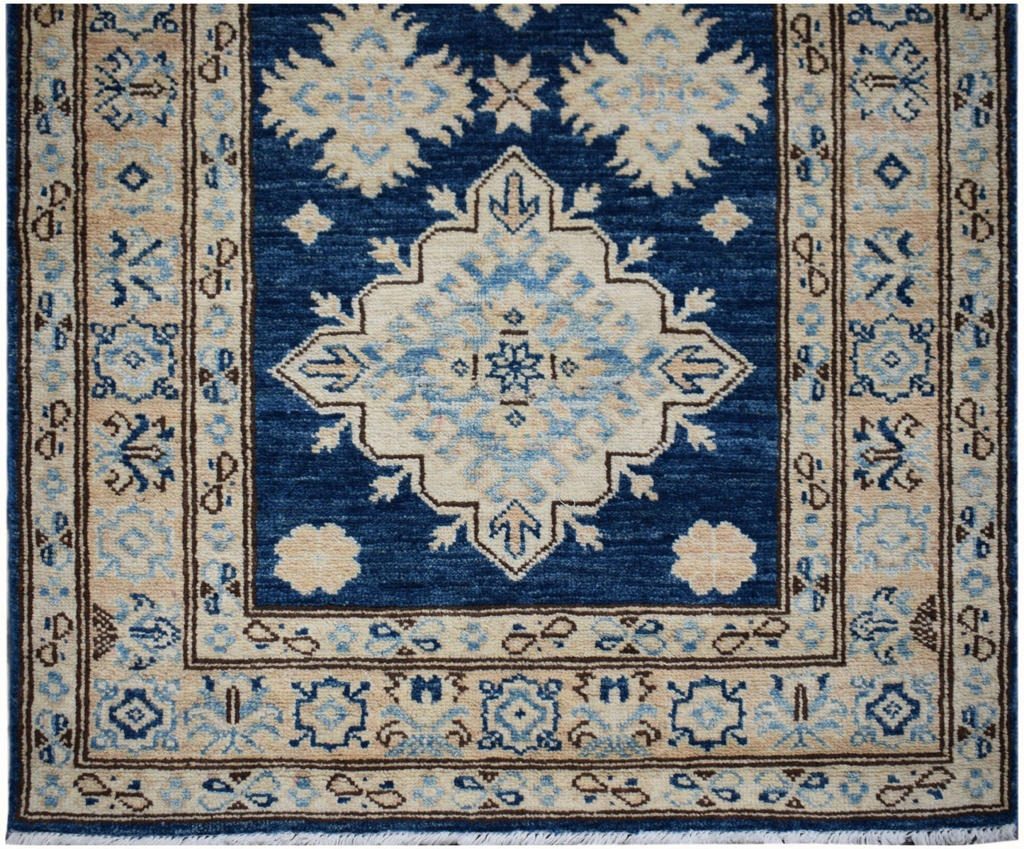 Handmade Afghan Super Kazakh runner rug featuring a blue field with beige geometric medallions.