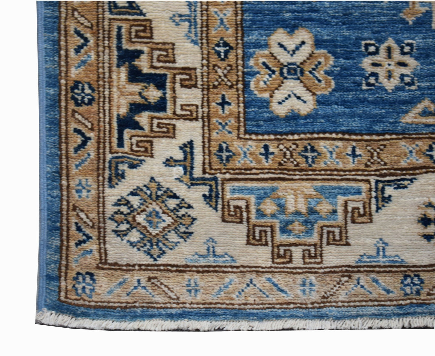 A handmade Afghan Super Kazakh runner featuring traditional geometric motifs in blue and tan wool.