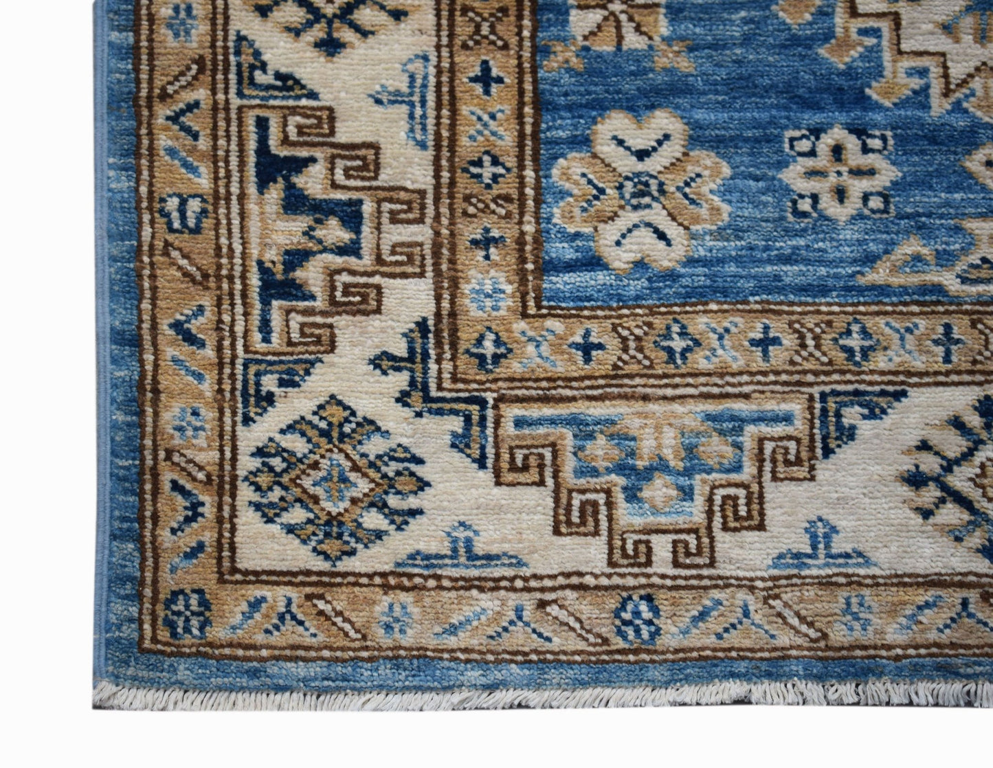 A handmade Afghan Super Kazakh runner featuring traditional geometric motifs in blue and beige.