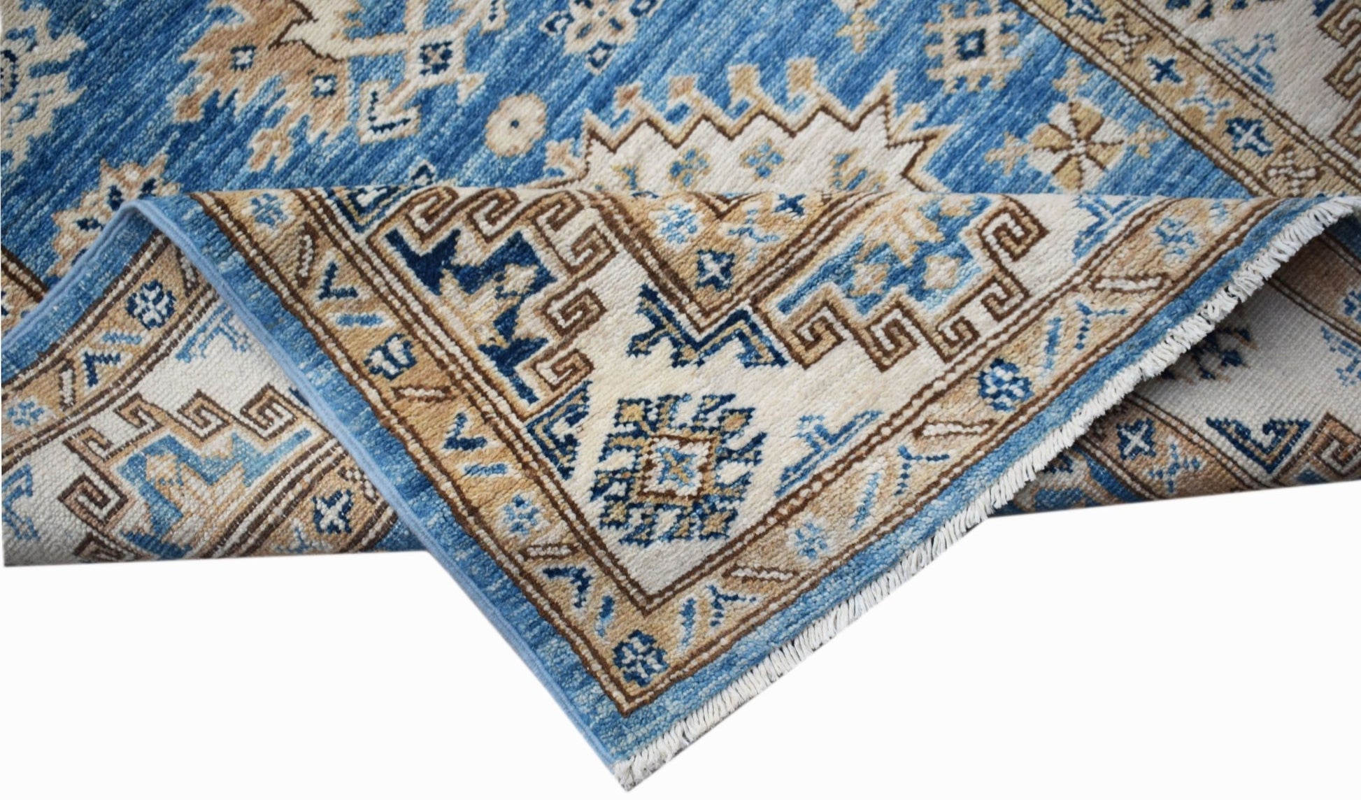A handmade Afghan Super Kazakh runner featuring traditional geometric motifs in blue and beige.