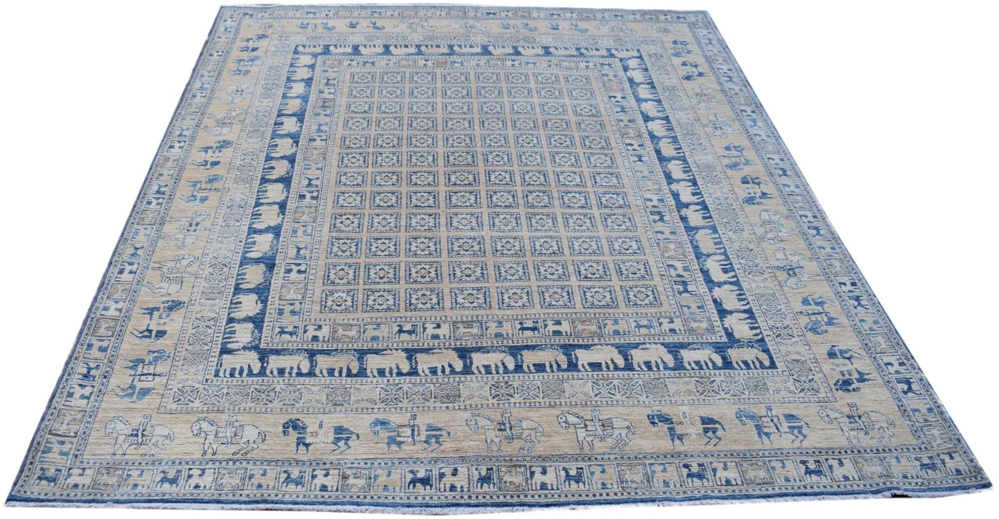 Handmade Afghan Chobi rug featuring a blue and beige grid pattern with animal motifs.
