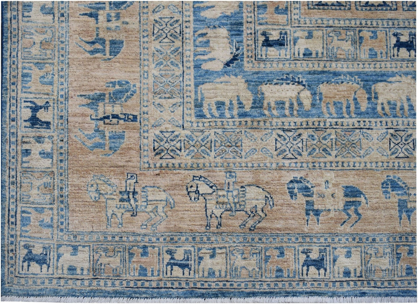 Handmade Afghan Chobi rug featuring blue and beige geometric patterns and equestrian motifs.