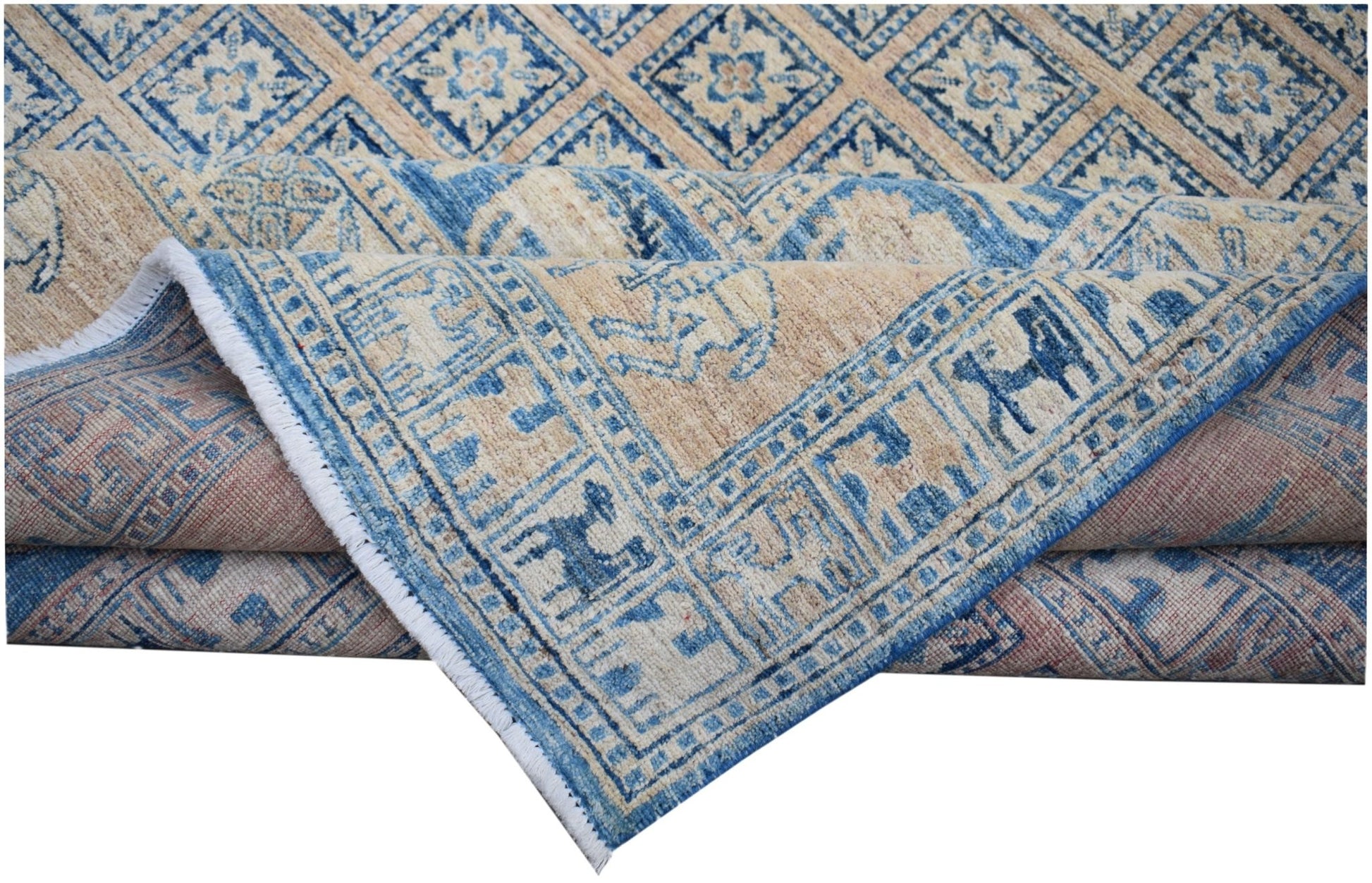 A handmade Afghan Chobi rug featuring a blue and beige geometric pattern with a fringed edge.