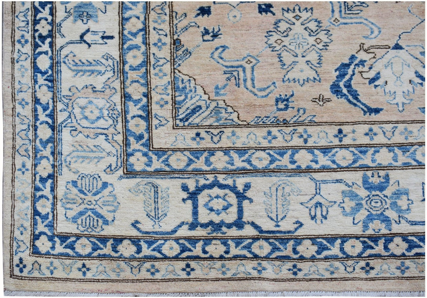 Handmade Afghan Super Kazakh rug featuring a beige field with intricate blue geometric patterns.