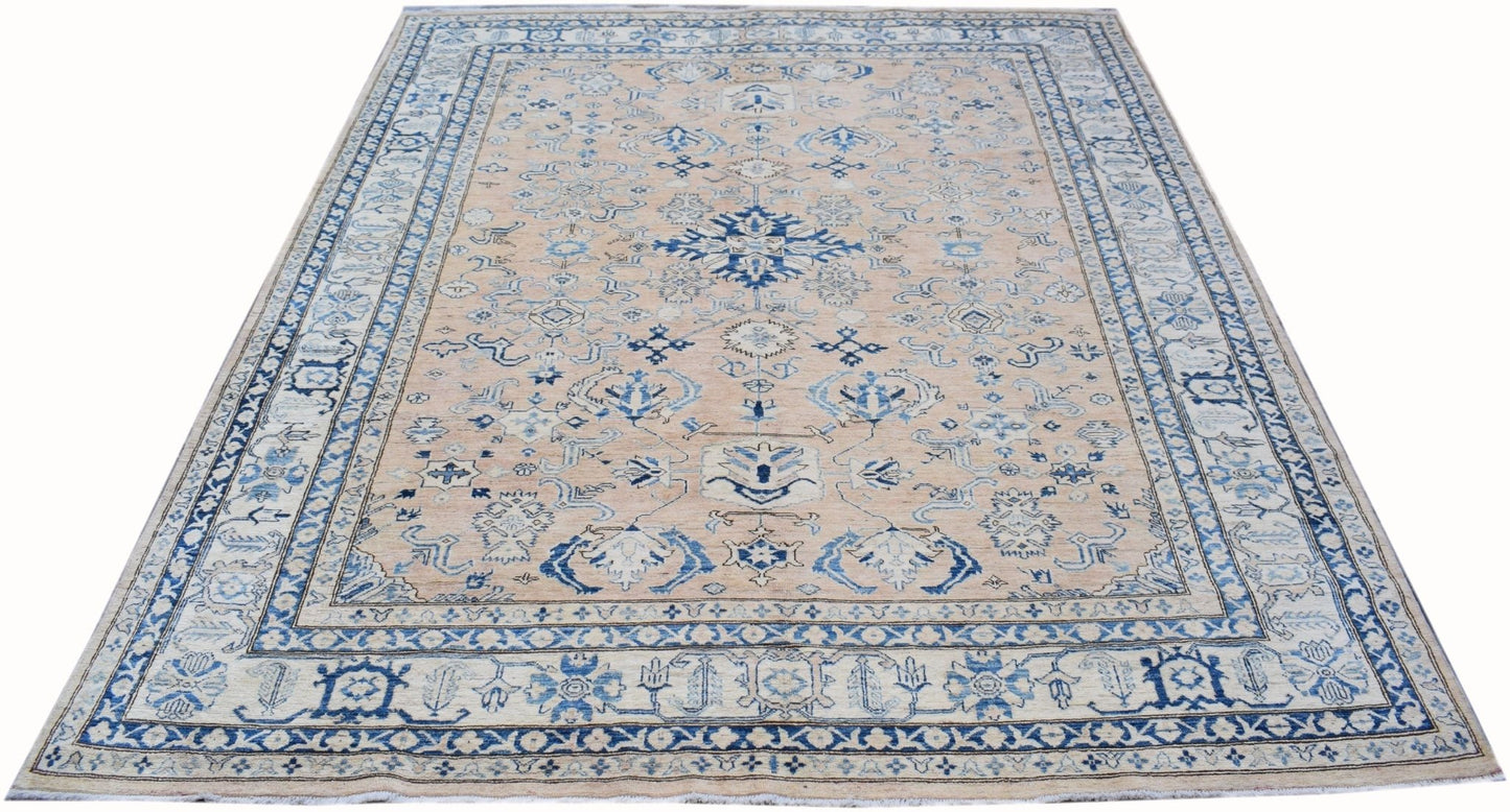 Handmade Afghan Super Kazakh rug featuring a beige field with intricate blue geometric patterns.