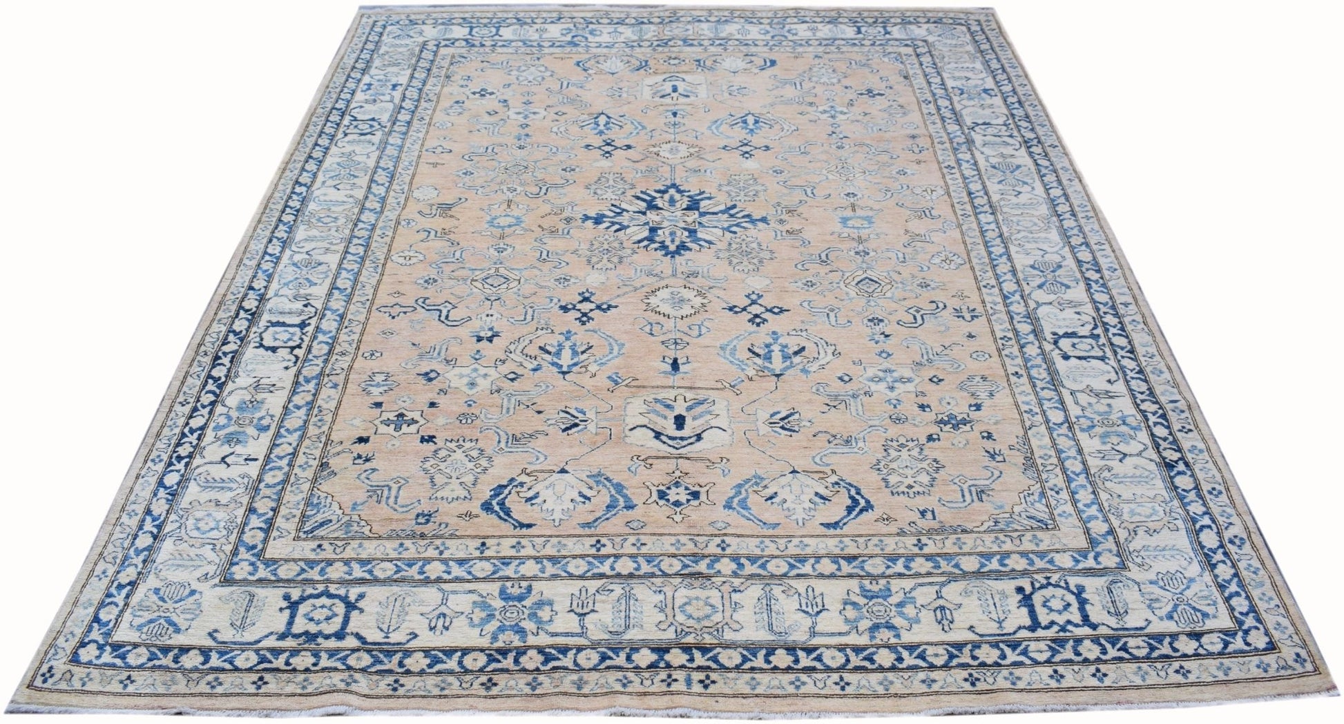Handmade Afghan Super Kazakh rug featuring a beige field with intricate blue geometric patterns.