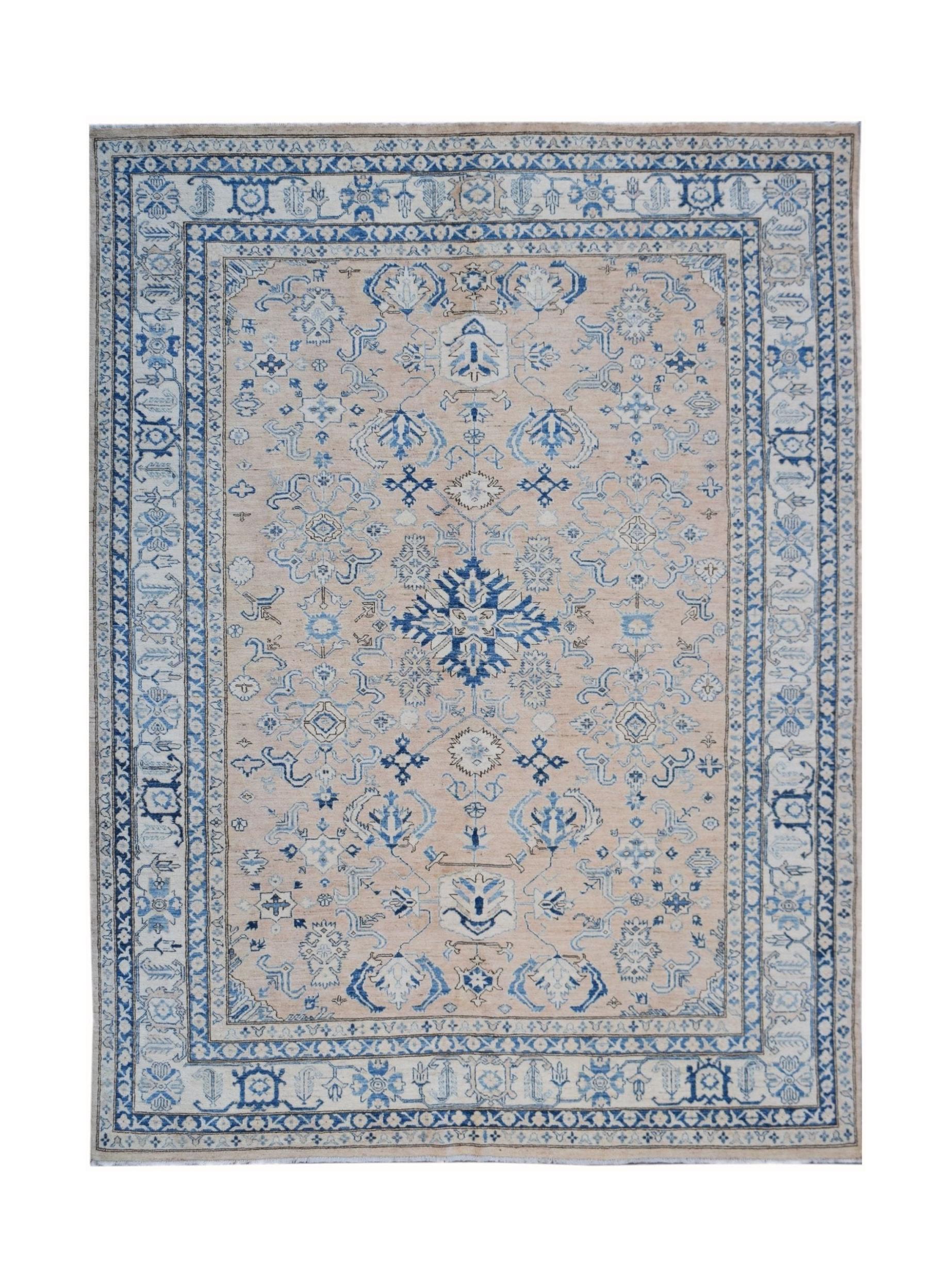 Handmade Afghan Super Kazakh rug featuring a beige field with intricate blue geometric patterns.