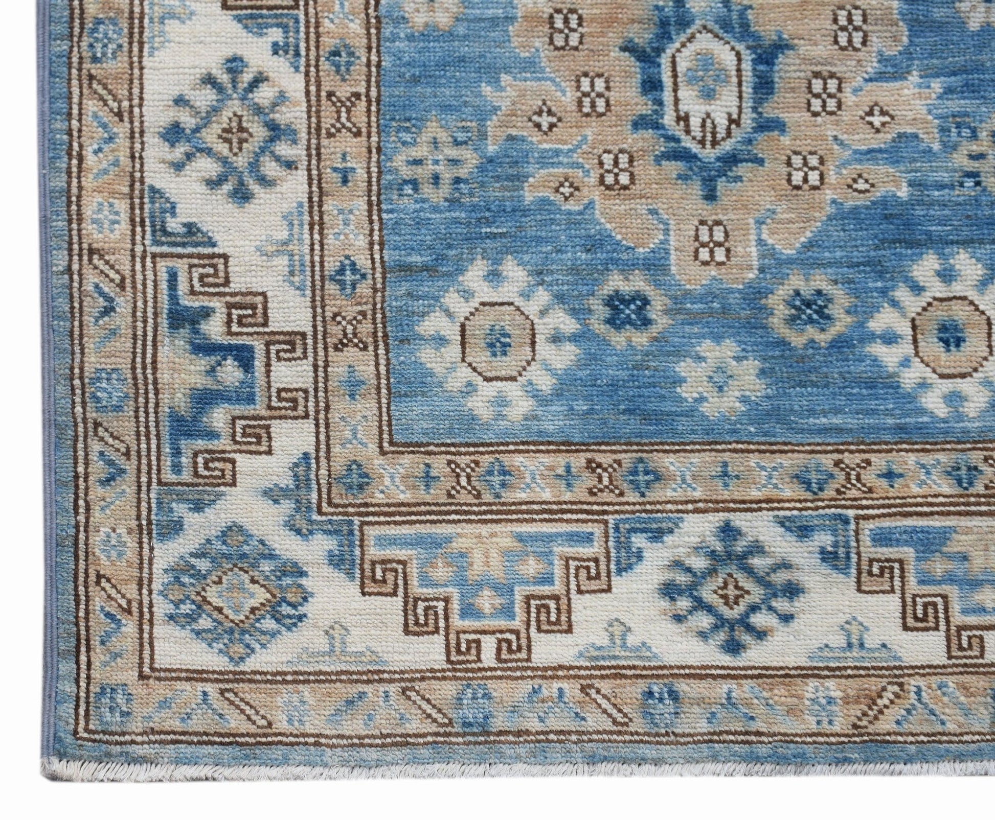 A handmade Afghan Super Kazakh runner featuring traditional blue and beige geometric patterns.