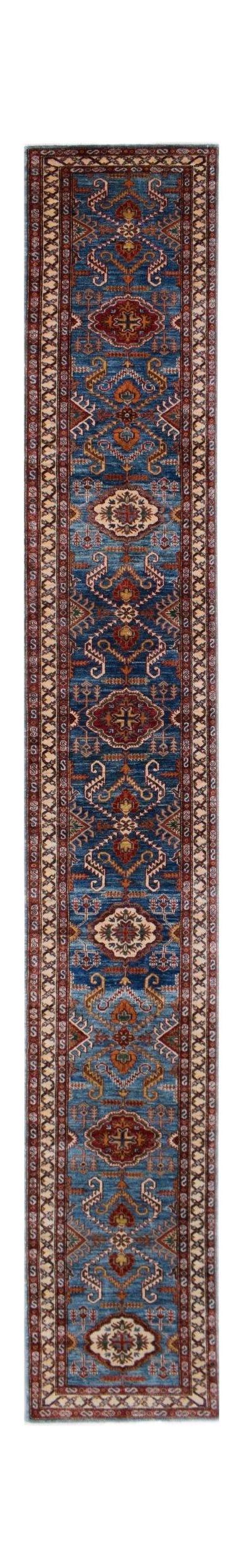 A long, handmade Afghan Super Kazakh runner rug featuring traditional geometric motifs in blue.