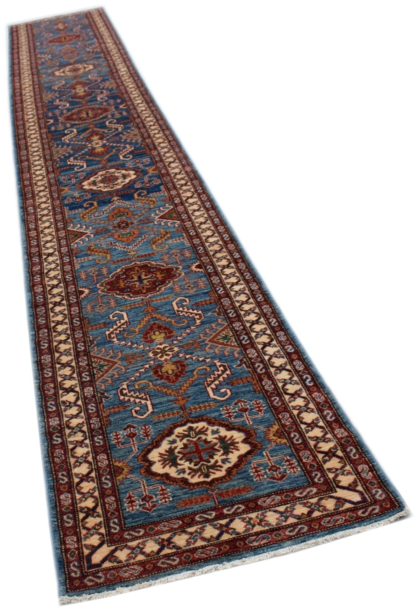A long, handmade Afghan Super Kazakh runner rug featuring traditional geometric motifs in blue.