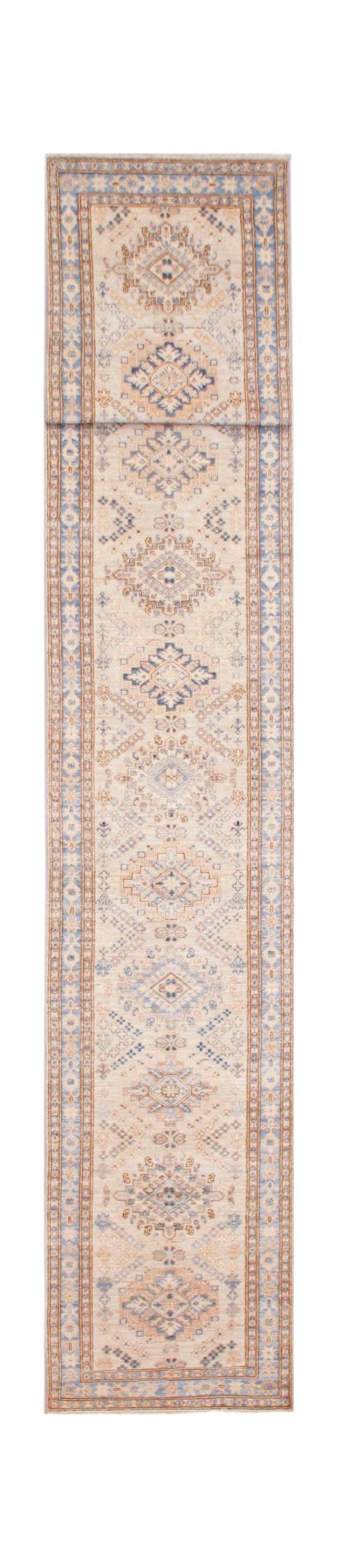 A long, handmade Afghan Super Kazakh runner rug featuring traditional geometric motifs in blue and tan.