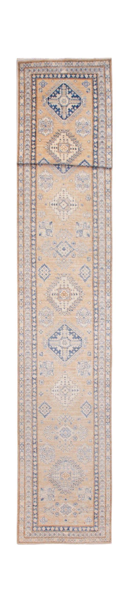 An Afghan Super Kazakh runner rug featuring traditional blue geometric motifs on a tan background.