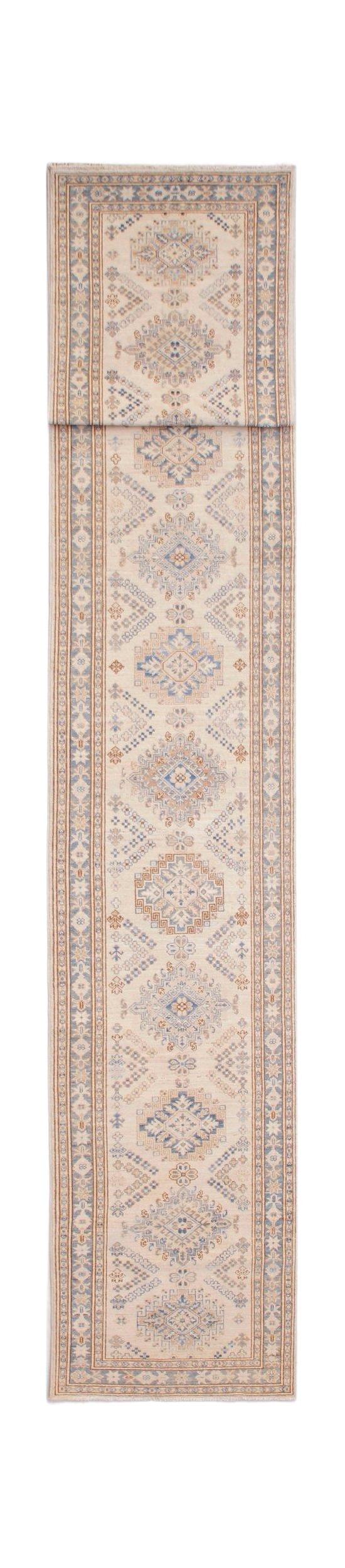 A long, handmade Afghan Super Kazakh runner featuring traditional geometric motifs in blue and tan.